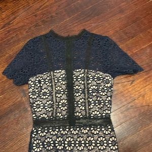 Navy and black floral cutout lace mini dress.
